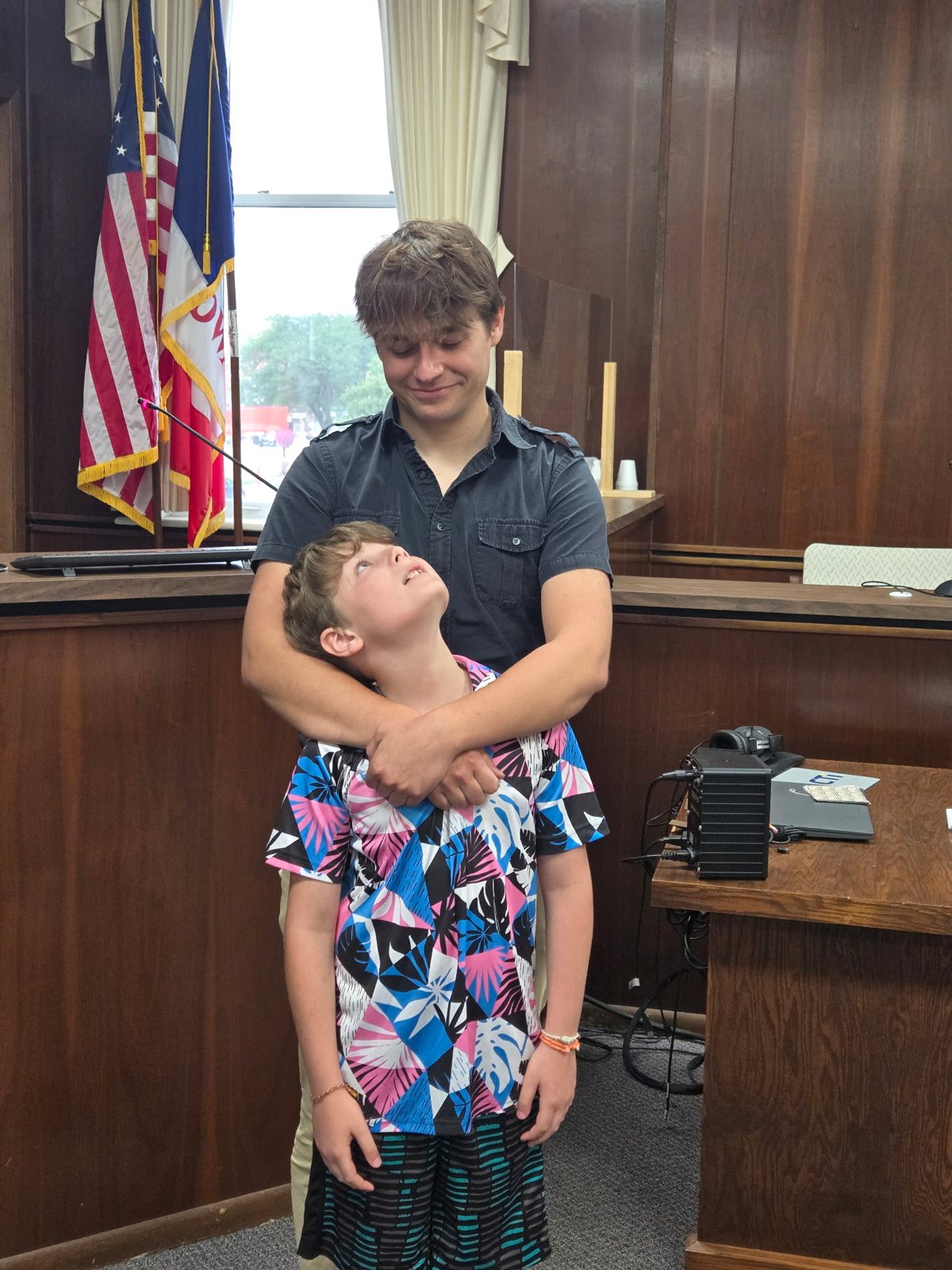 Jesse and Carter in the courtroom on adoption day
