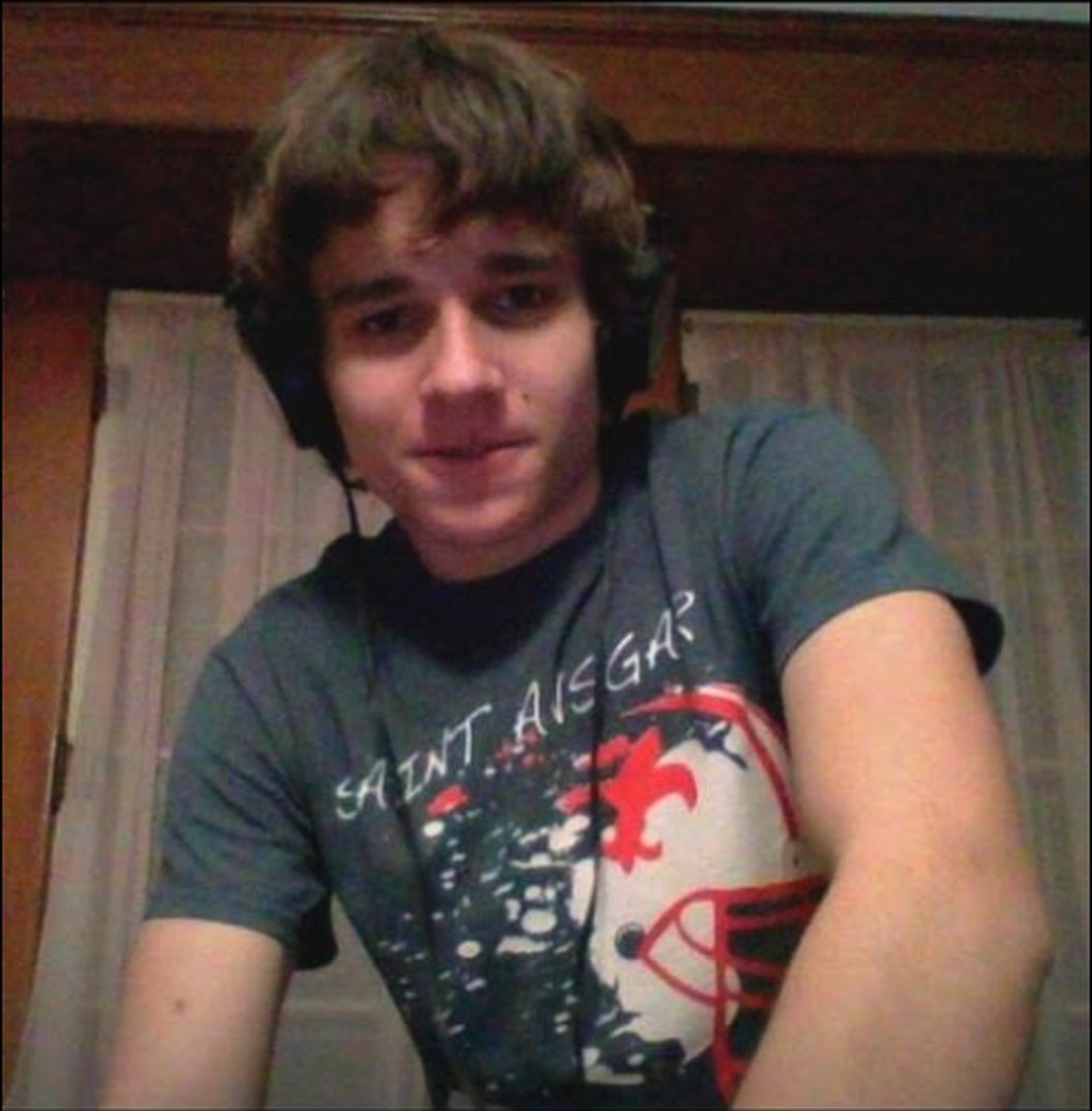 Jesse at fifteen, headphones on, at the DJ board